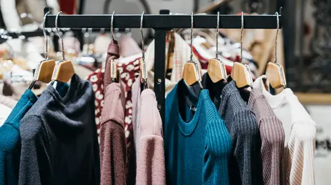 fashion clothing on hangers at the show