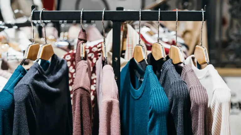 fashion clothing on hangers at the show